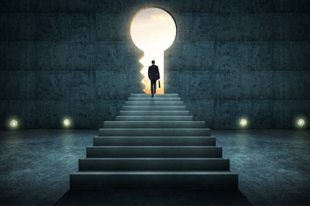 Sucess businessman climbing on stair against conrete wall with key hole door ,sunrise scene city skyline outdoor view .